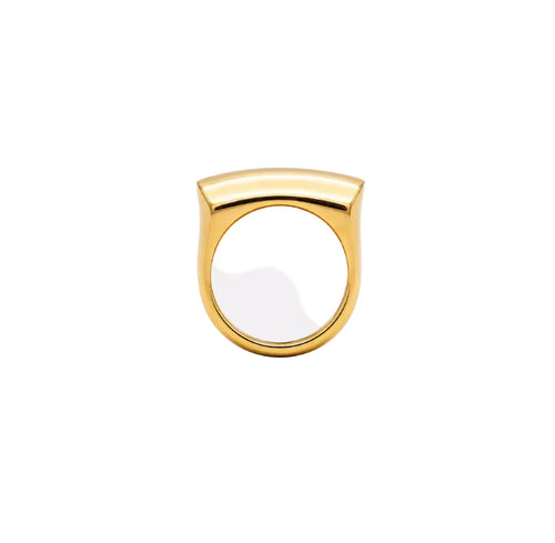 Gold ring with a white stone on a white background