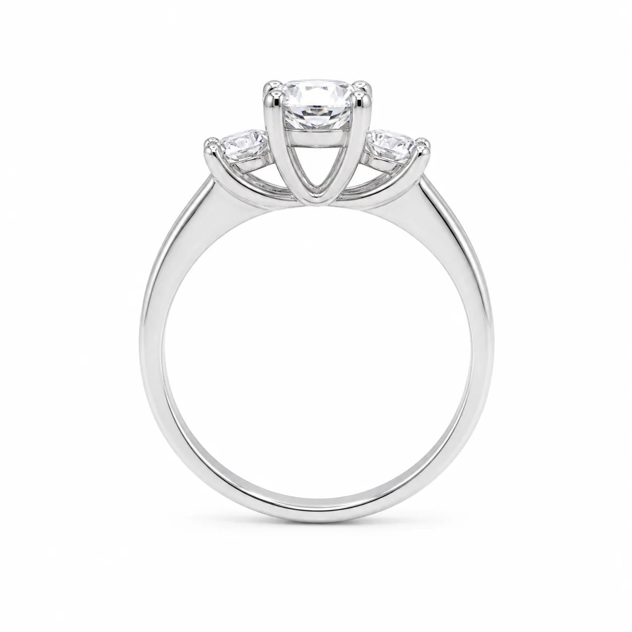 Silver ring with three diamond stones on a white background