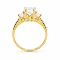 Gold ring with a diamond on a white background