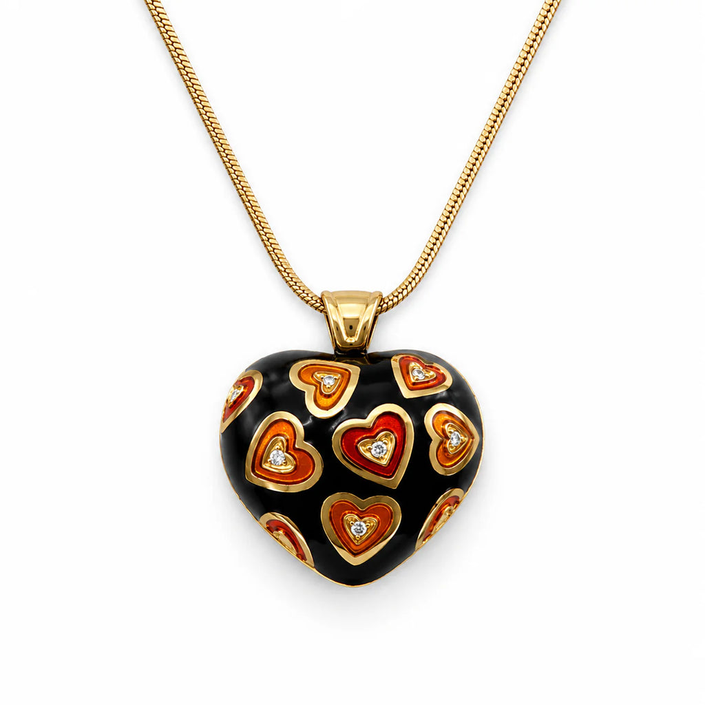 Hearth shaped Necklace with a decorative pendant black and orange colored