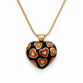 Hearth shaped Necklace with a decorative pendant black and orange colored
