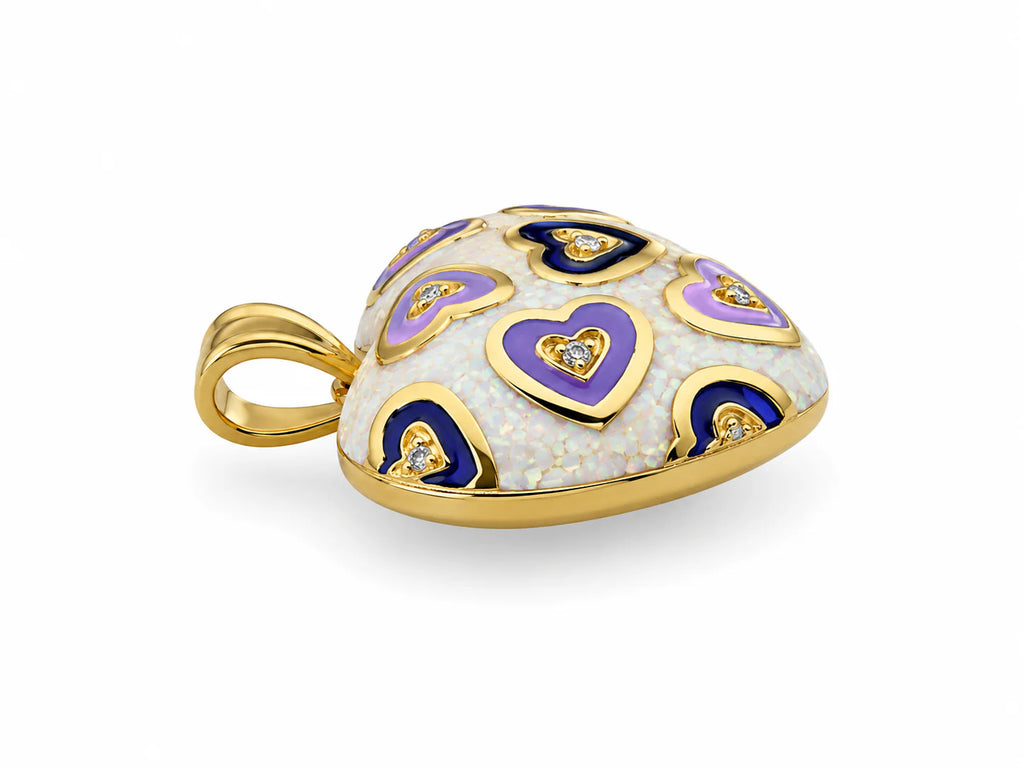 Heart-shaped pendant with gold, purple, and lilac enamel on a white background