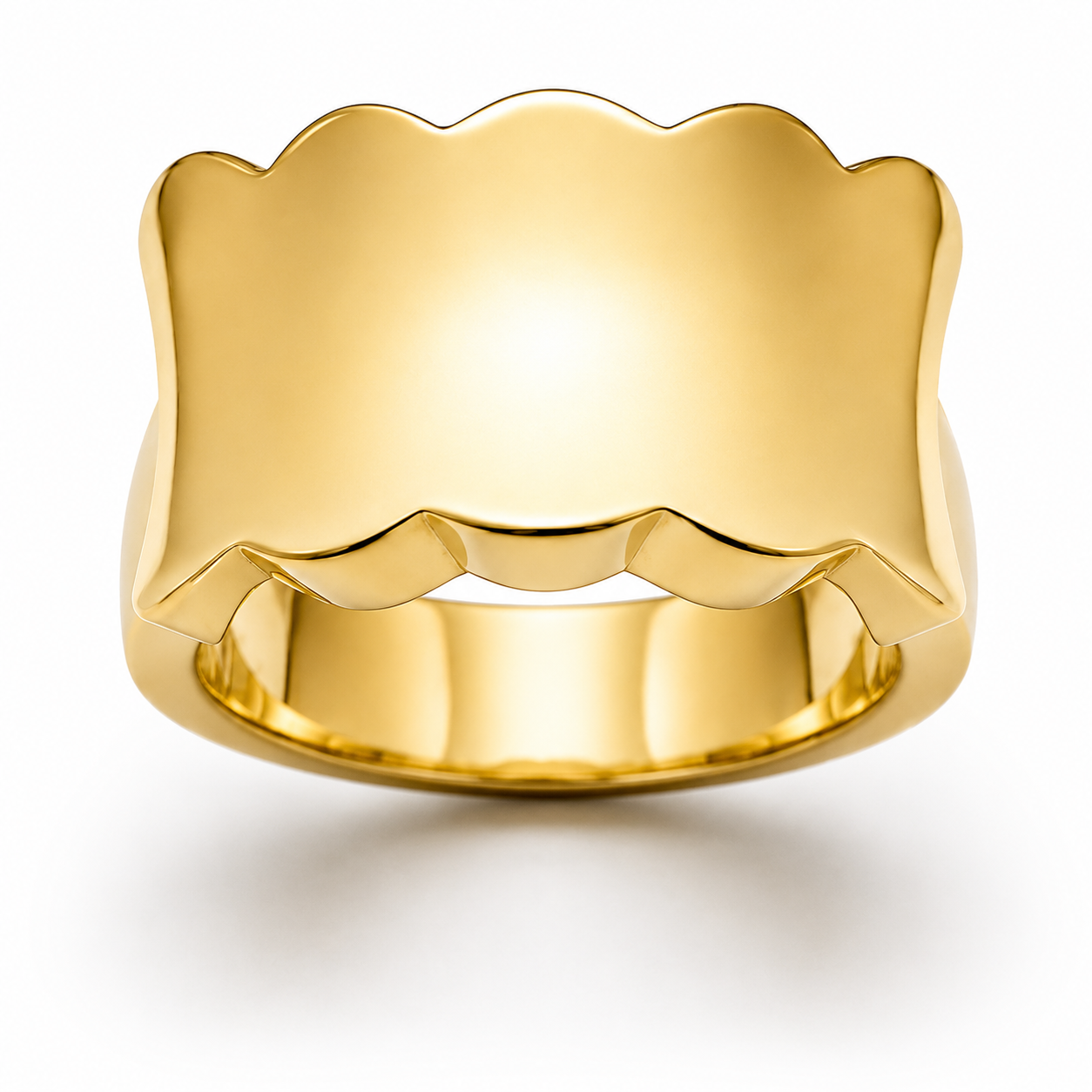 Gold ring with scalloped edge design on a white background