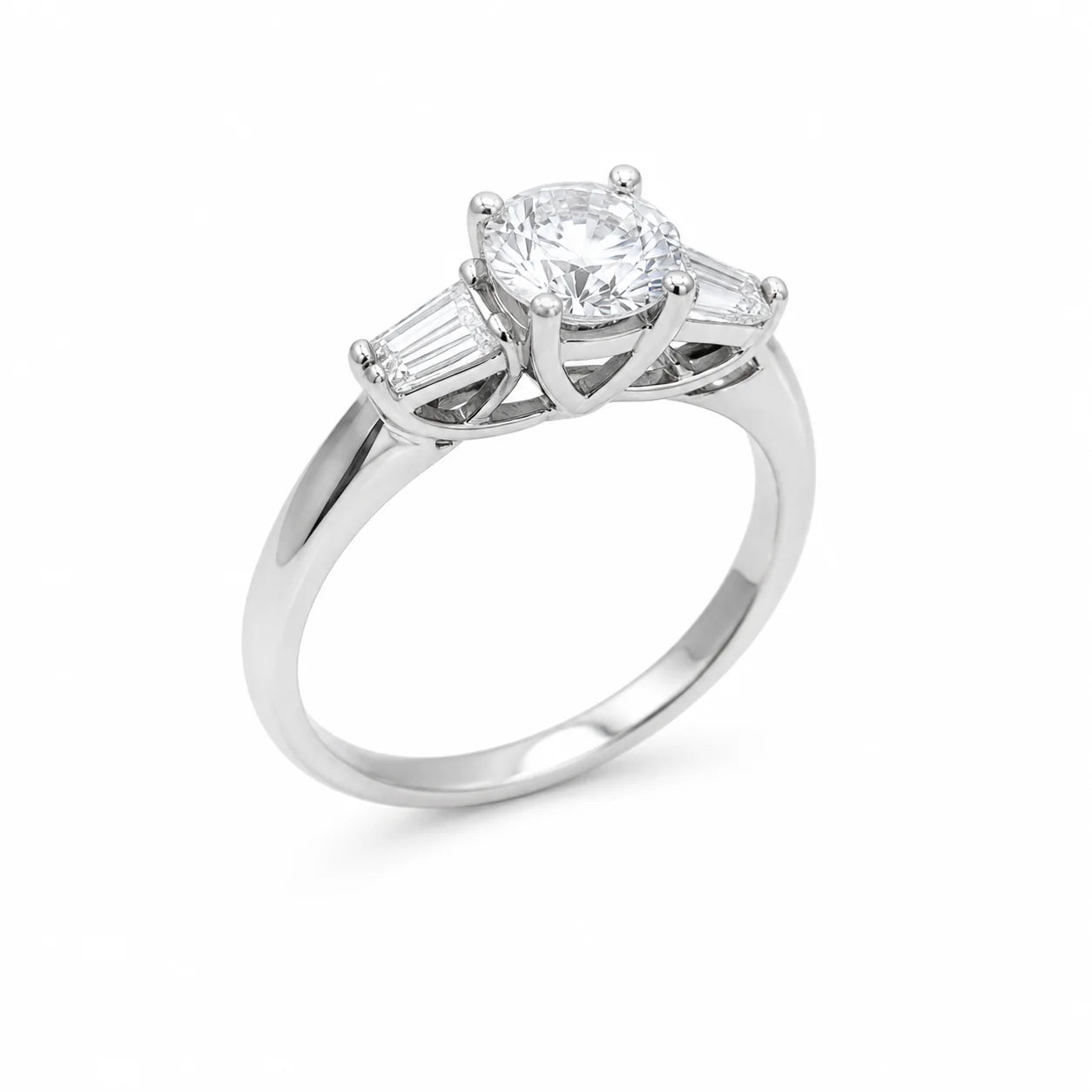 Diamond ring with two baguette diamonds on a white background