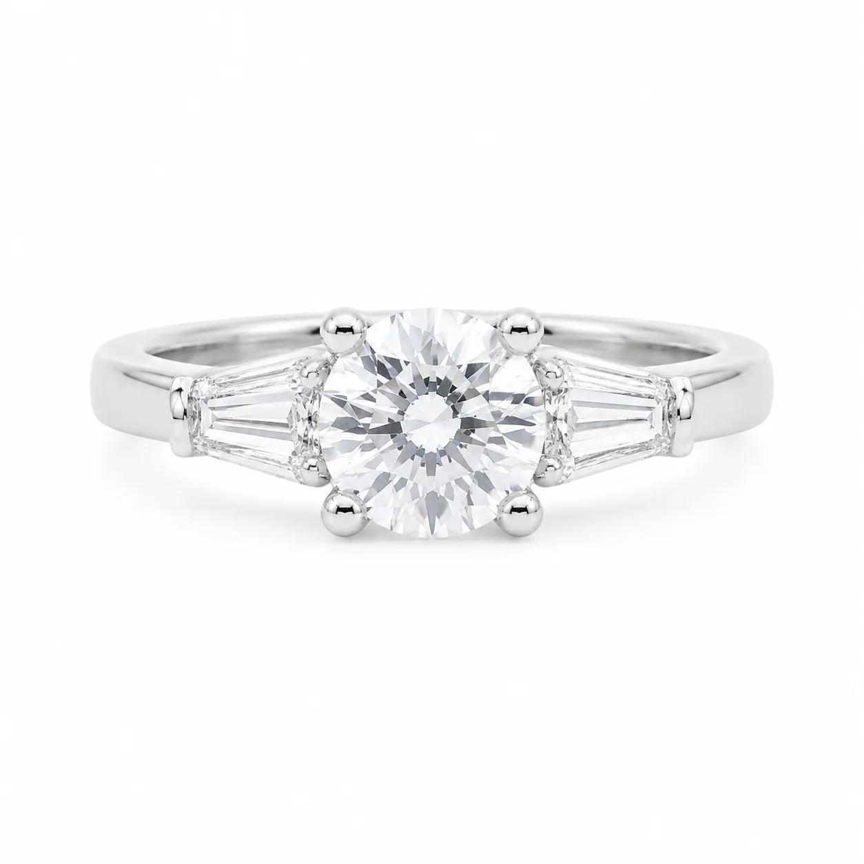 Silver ring with a large central diamond and smaller baguette-cut diamonds on a white background