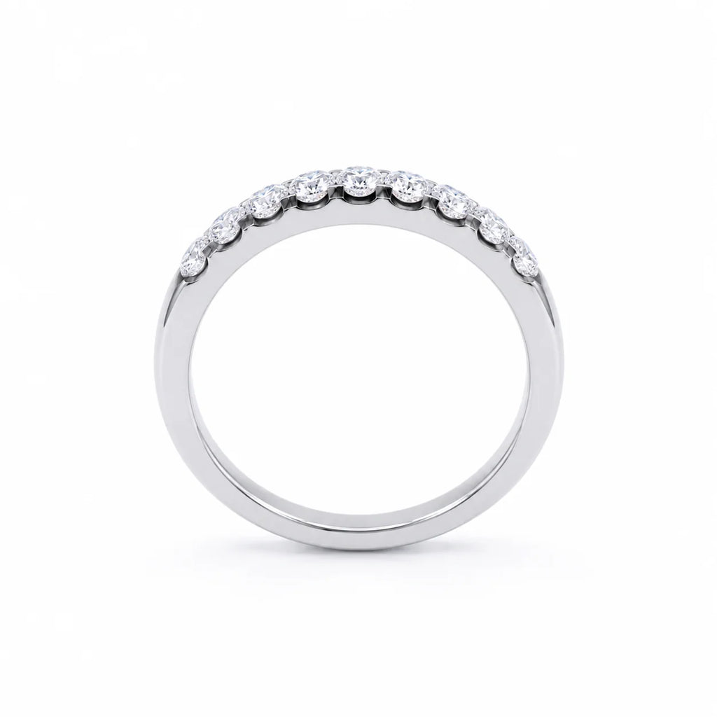 Silver ring with small diamonds on a white background