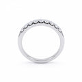 Silver ring with small diamonds on a white background
