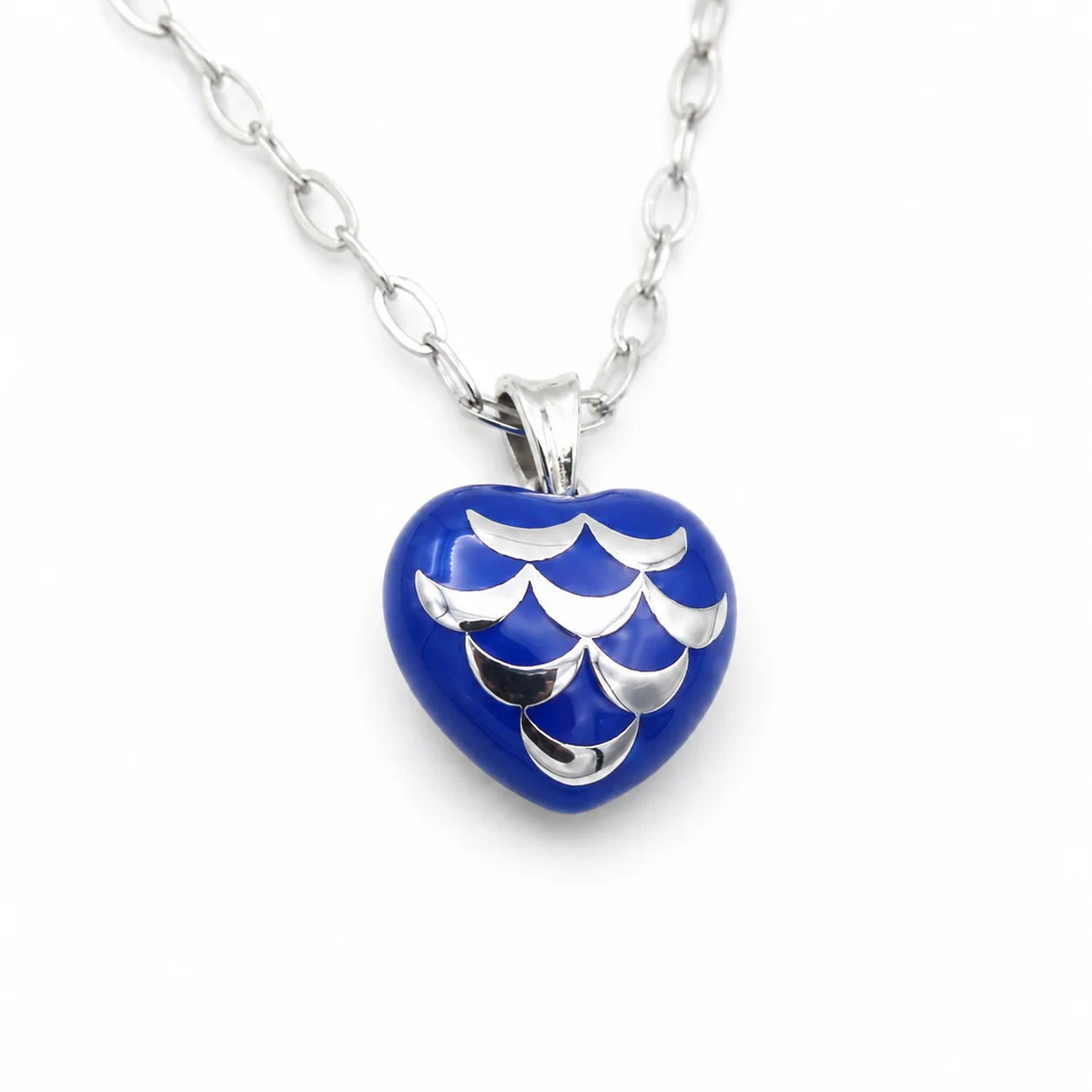 Heart-shaped pendant with blue and silver design on a white background