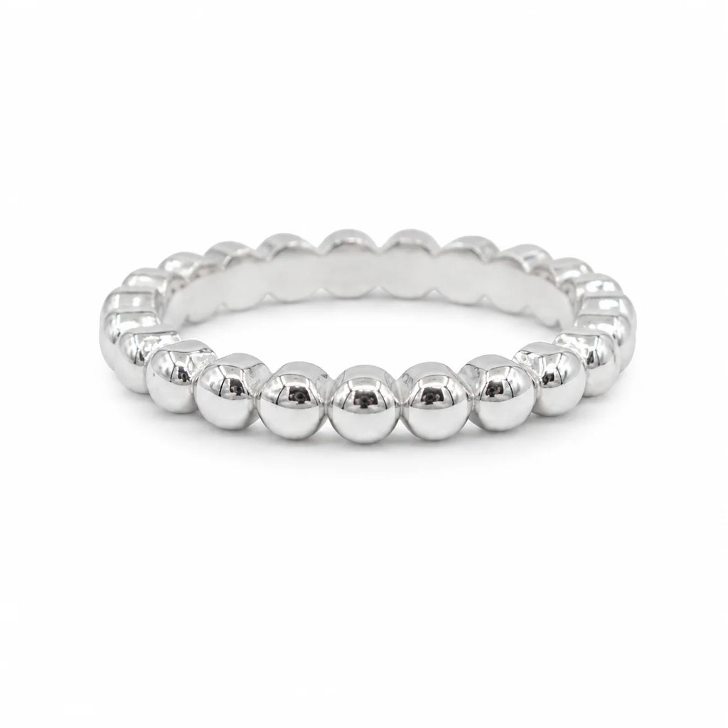 Silver beaded ring on a white background