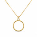 Gold necklace with a circular pendant on a white background
