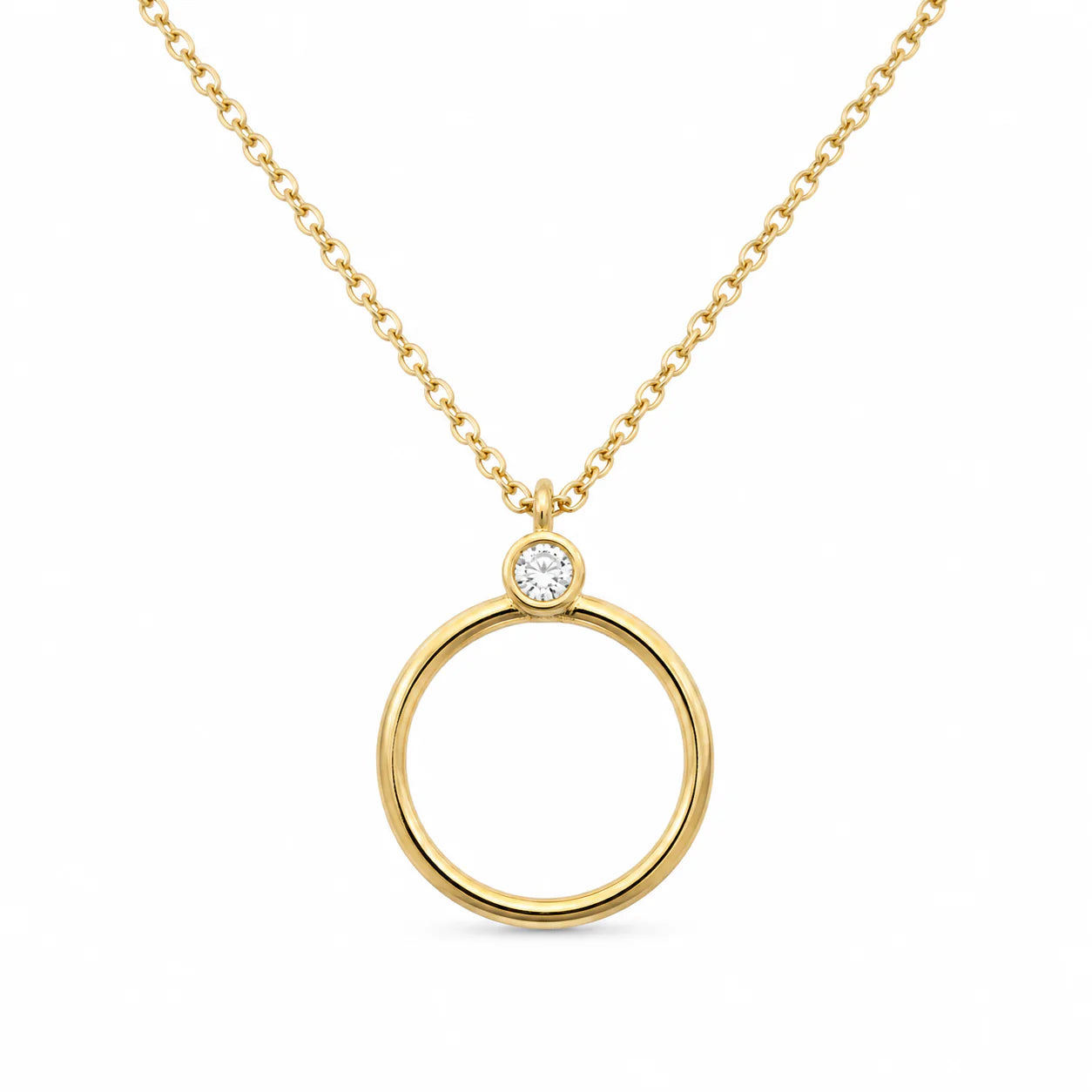 Gold necklace with a circular pendant on a white background