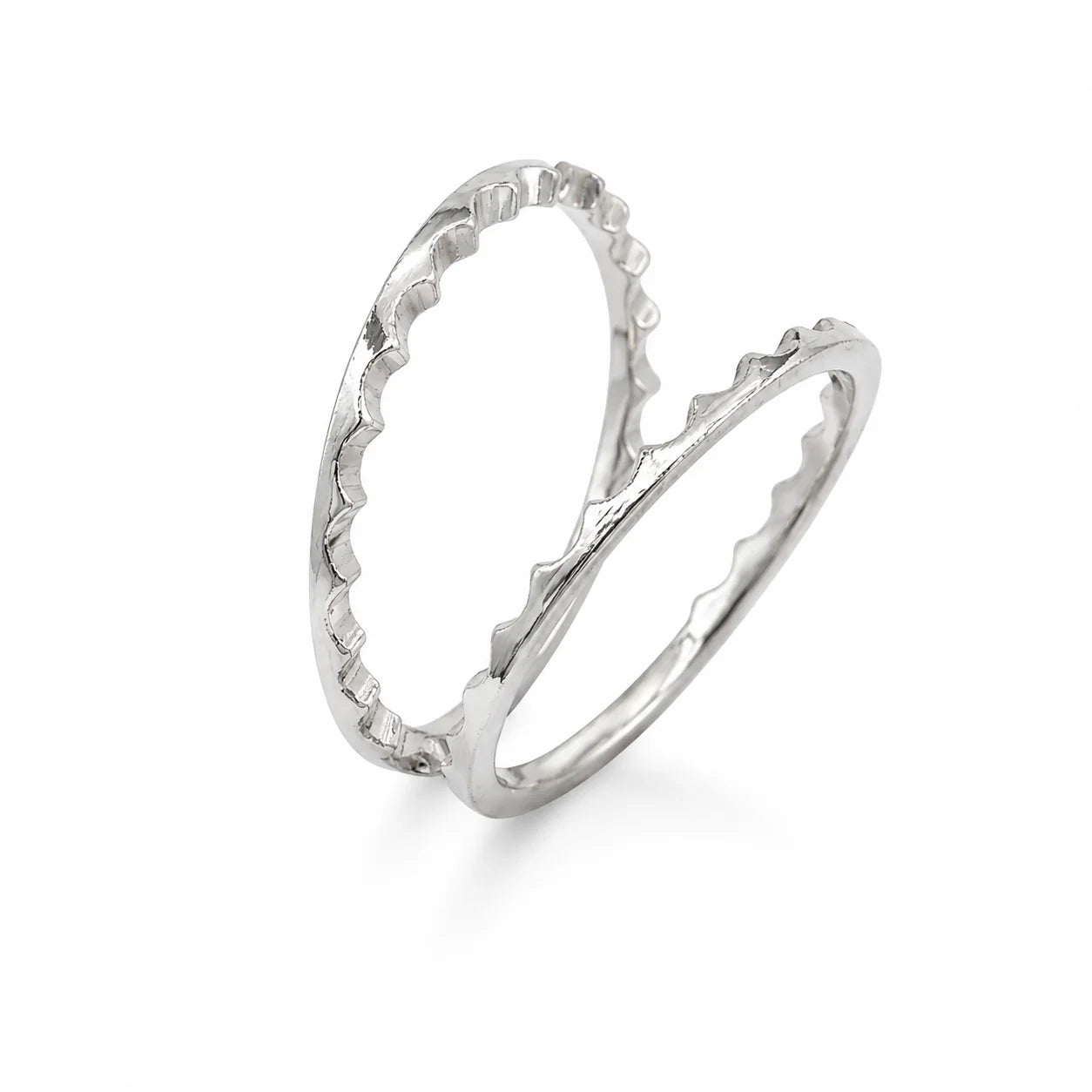Silver ring with a textured design on a white background