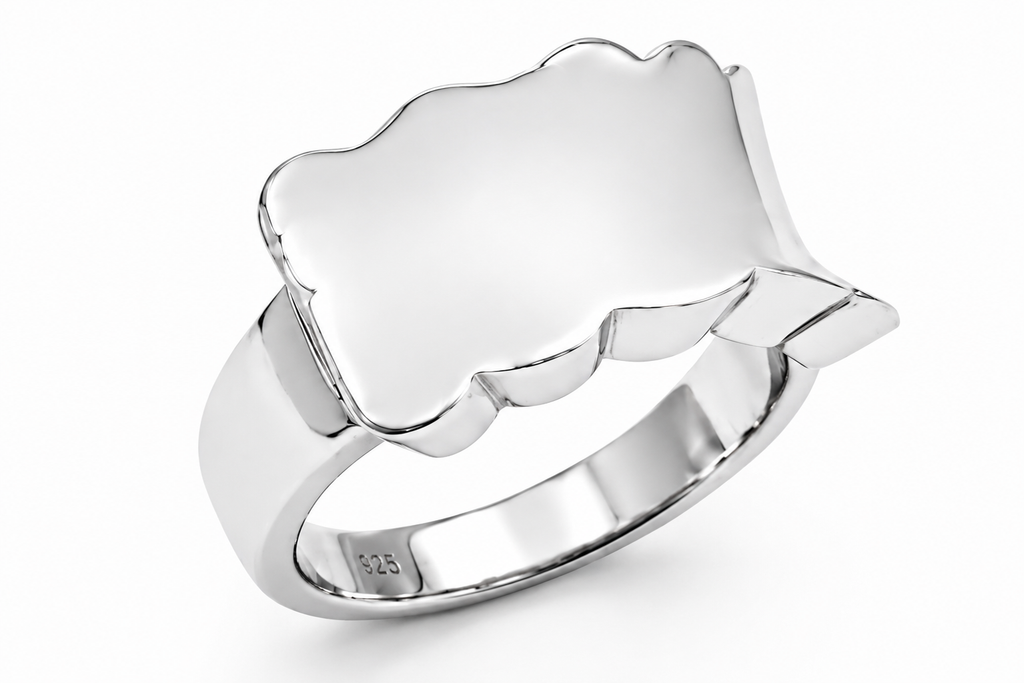 Silver ring with a textured band on a white background