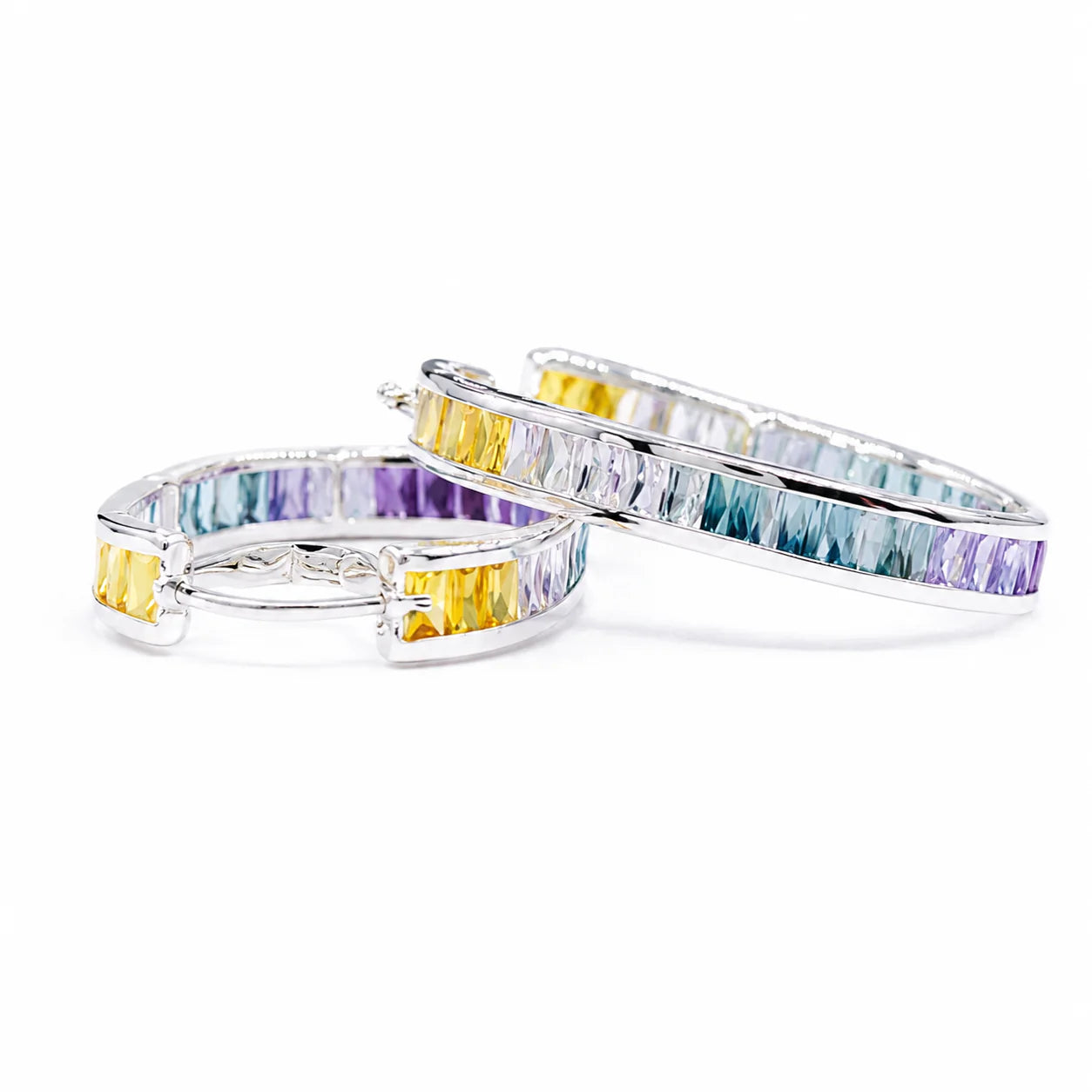 Pair of hoop earrings with multicolored gemstones on a white background