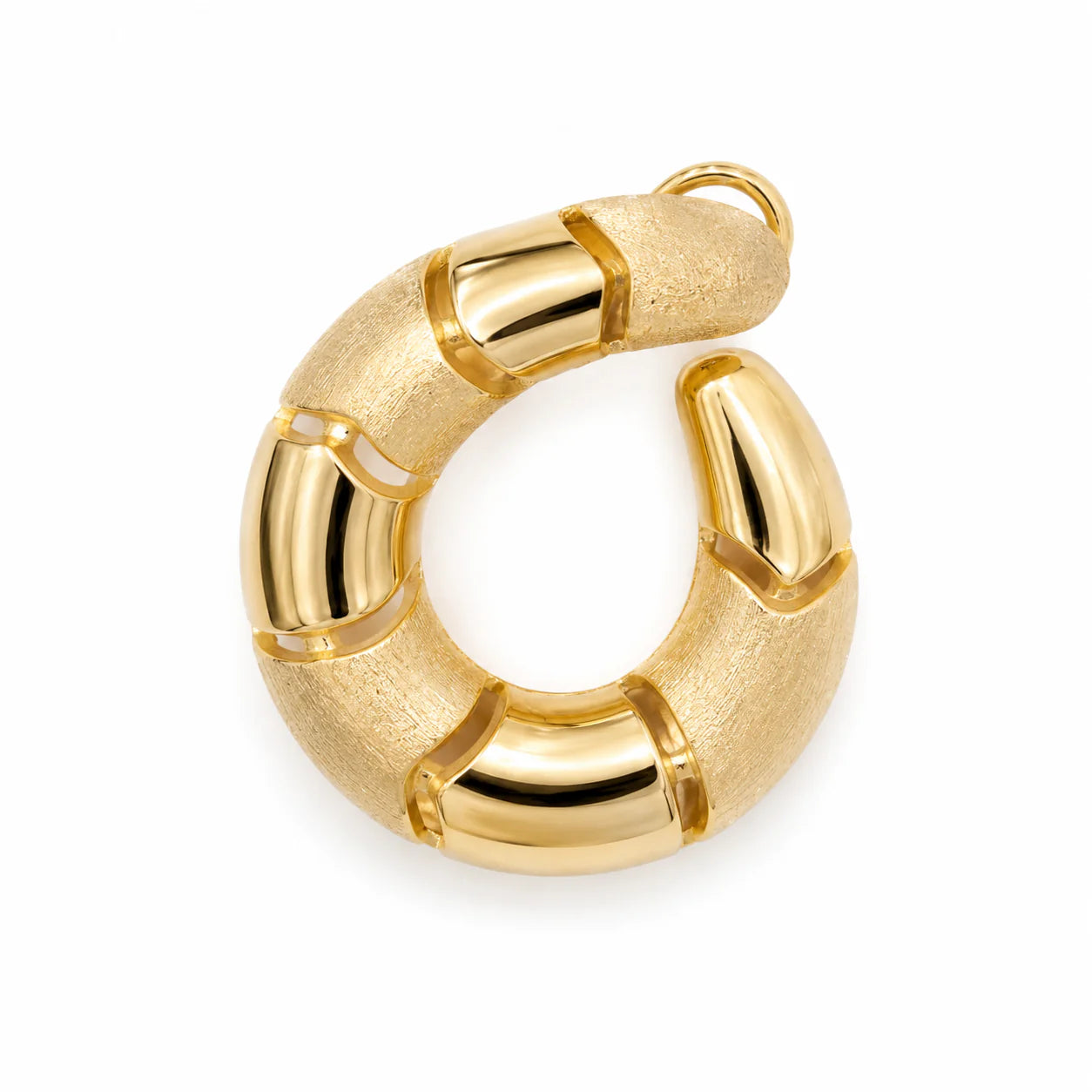 Gold hoop earring on a white background