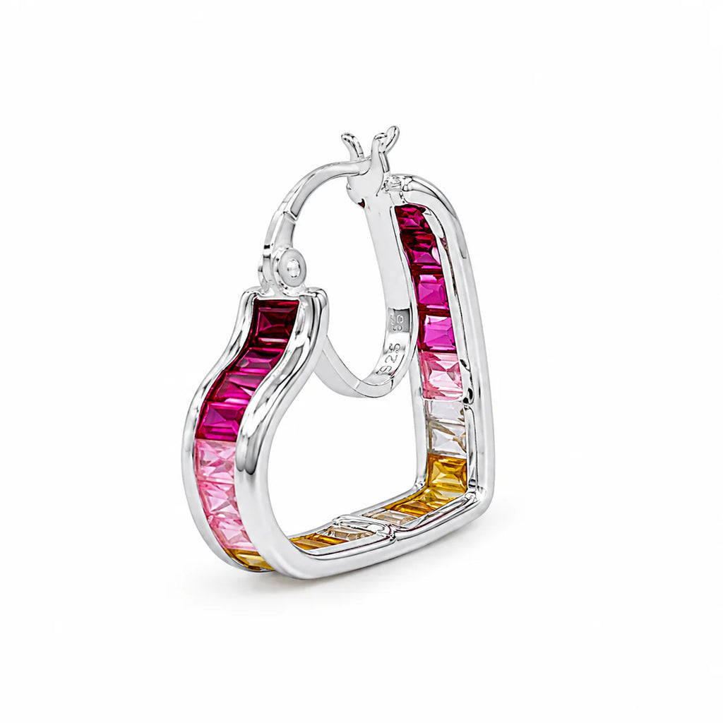 Silver hoop earrings with pink and yellow gemstones on a white background