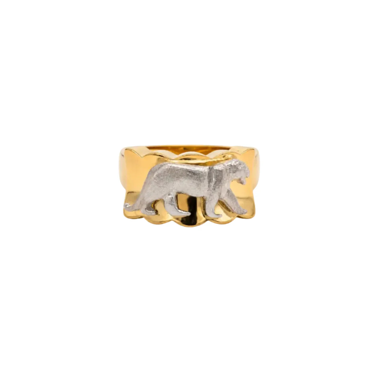 Gold ring with a silver tiger design on a white background