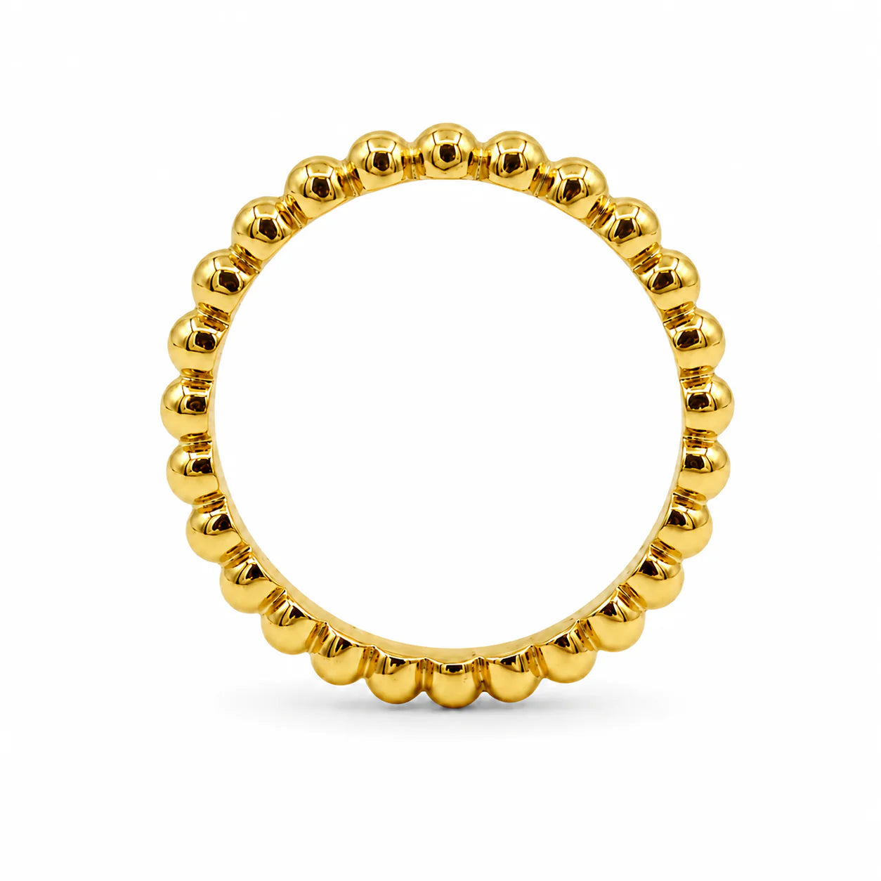 Gold beaded ring on a white background