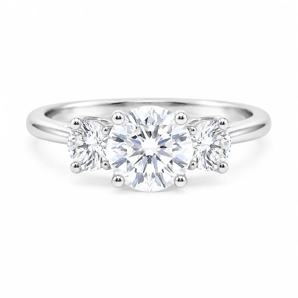 Three-stone diamond ring on a white background