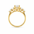 Gold ring with a diamond on a white background
