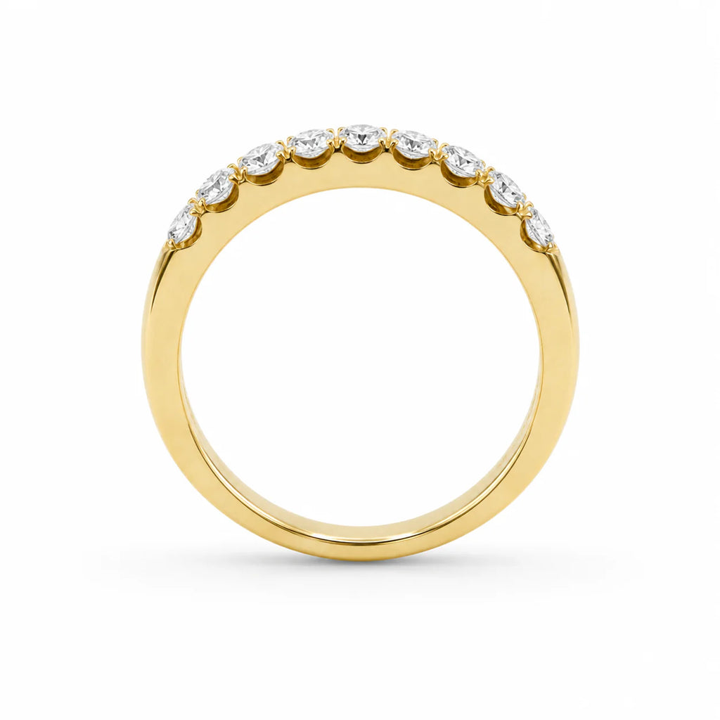 Gold ring with small diamonds on a white background