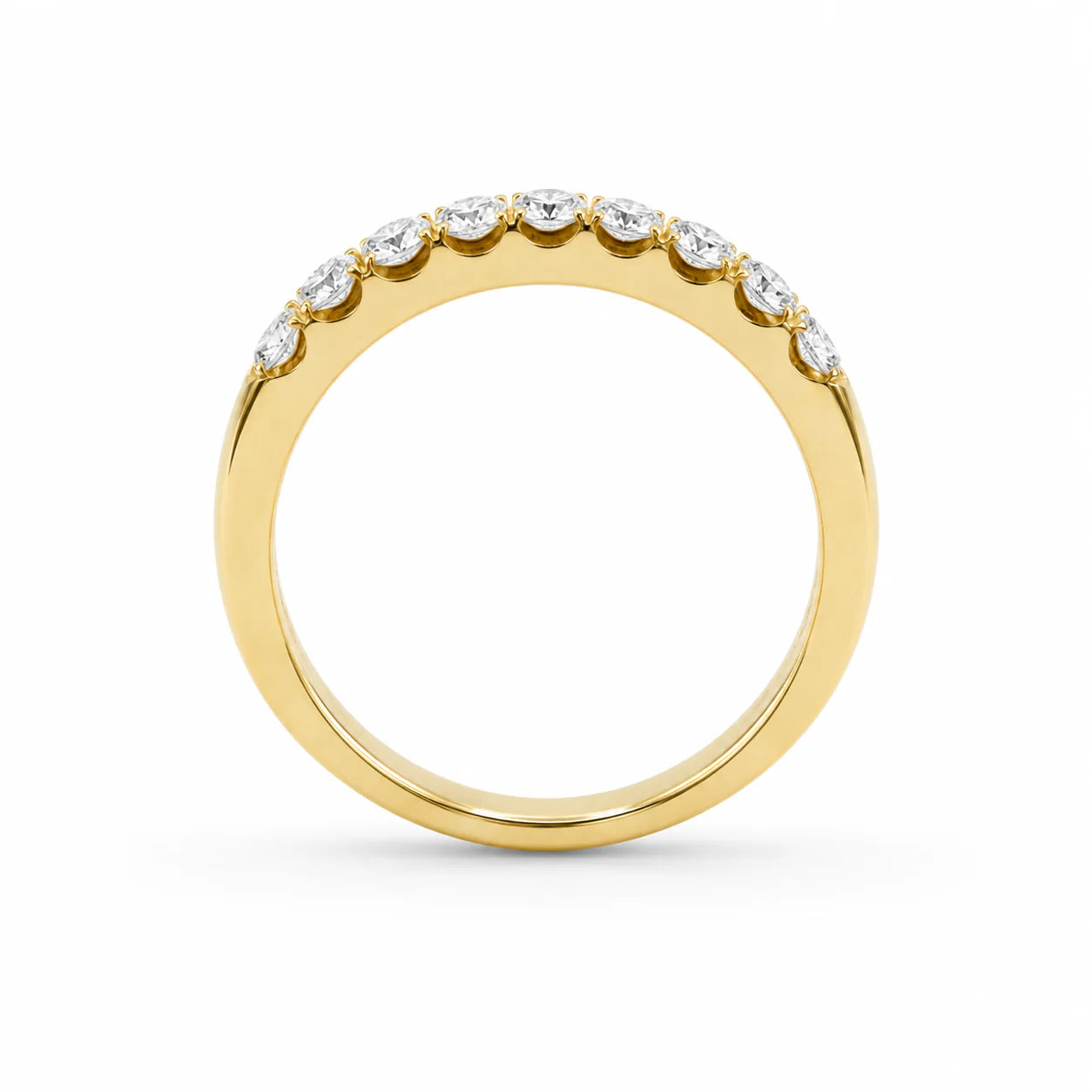 Gold ring with small diamonds on a white background