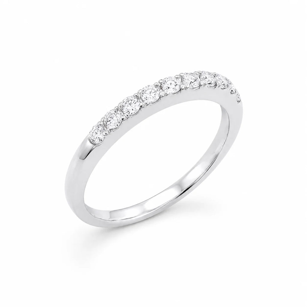 Silver ring with small diamonds on a white background