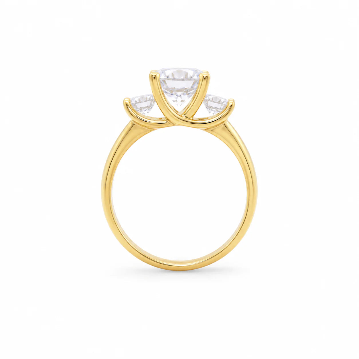 Gold ring with three diamond stones on a white background