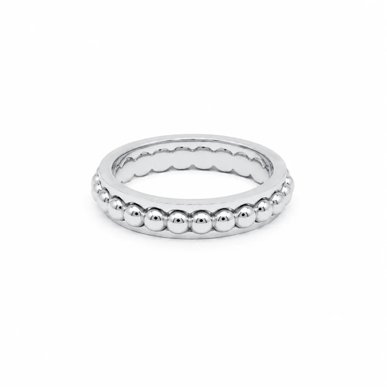 Silver ring with beaded design on a white background
